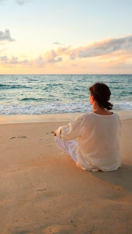 person sitting on the beach