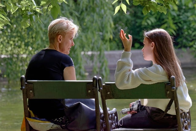 people on bench talking