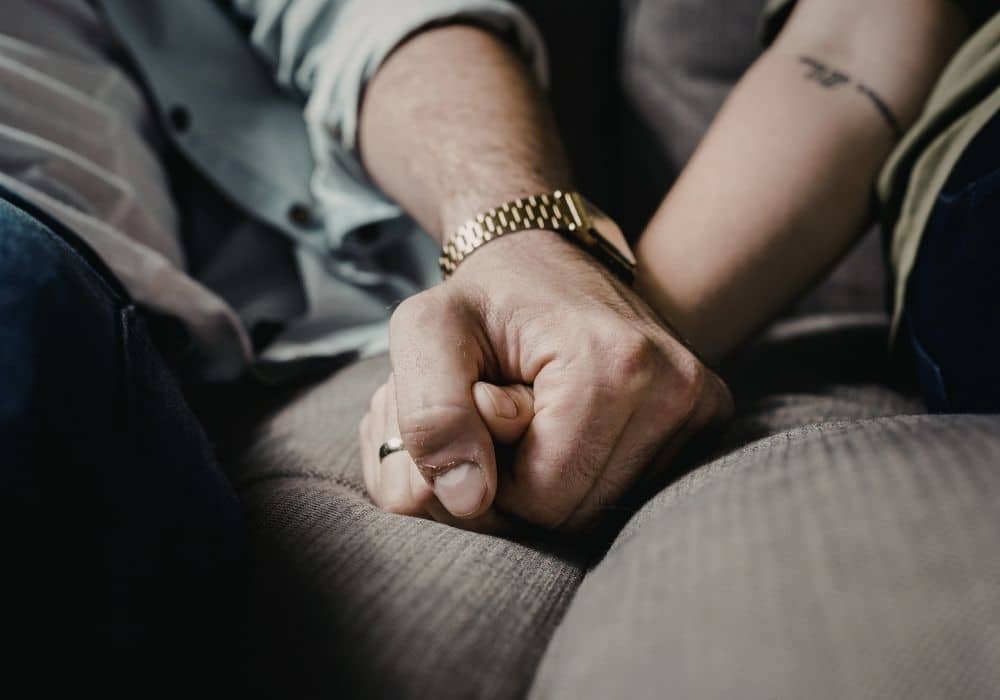 couple holding hands together
